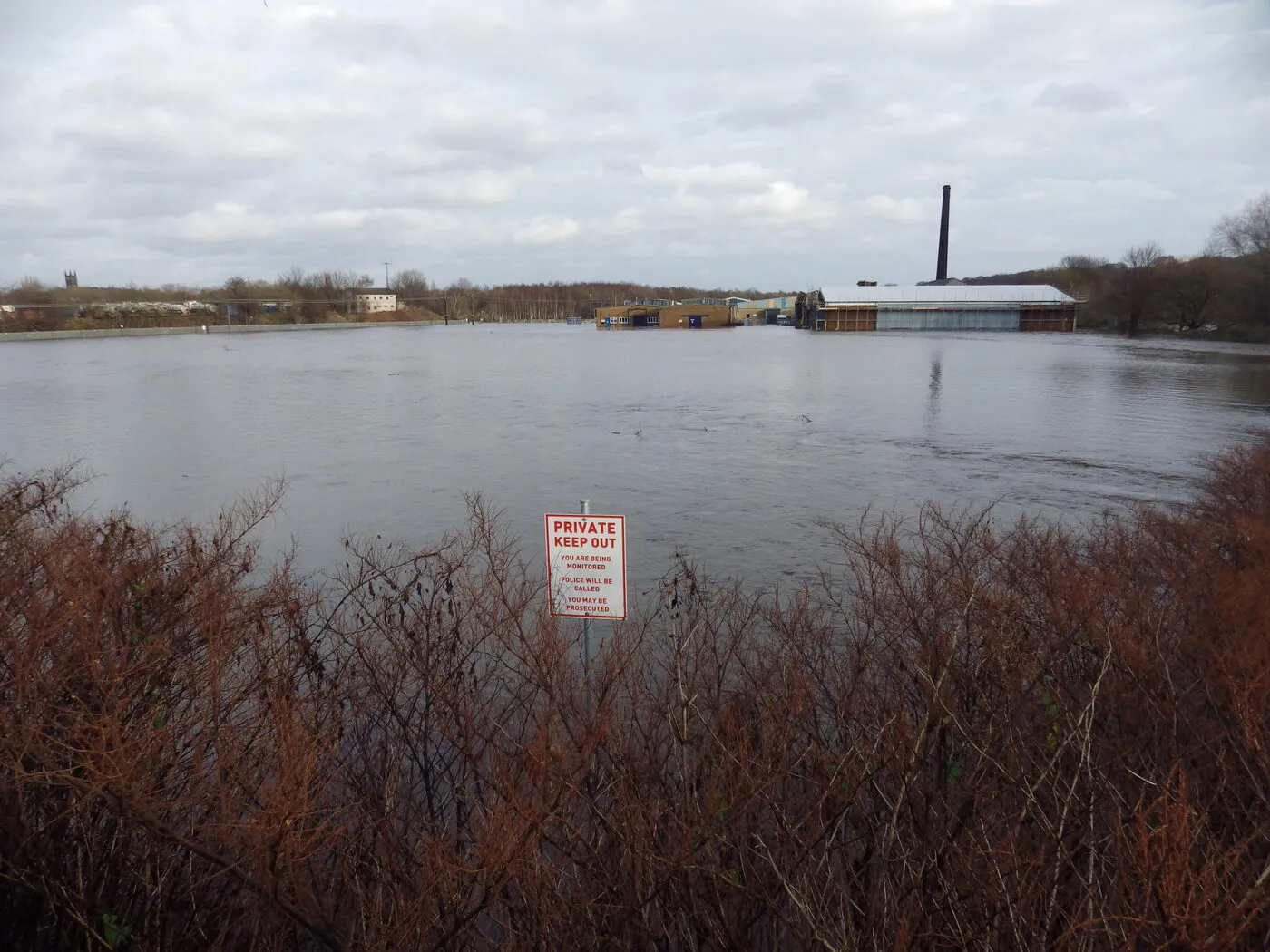 Flooded fields stretching to a distant mill chimney on Boxing Day 2015.
