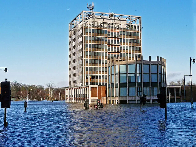 Carlisle Civic Centre standing in brown floodwater after Storm Desmond.