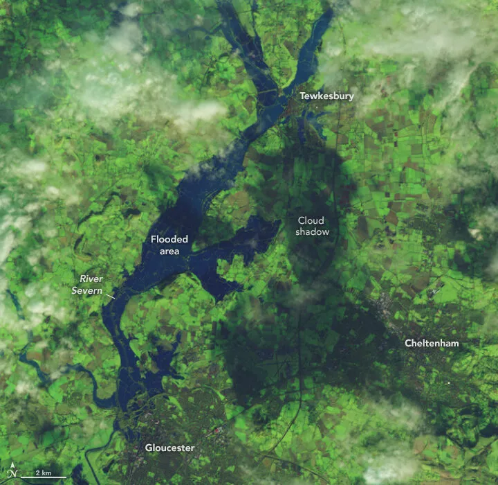 Satellite image of the River Severn spread wide across its floodplain between Tewkesbury and Gloucester.