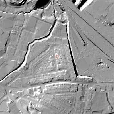 Shaded relief map of the ground around B112JE, computed from Environment Agency LiDAR. The ground here sits at about 116 m above sea level and falls 18 m across the surrounding 800 m. Surface water reaching this point runs off ground lying to the south-east, 5.4 m higher.