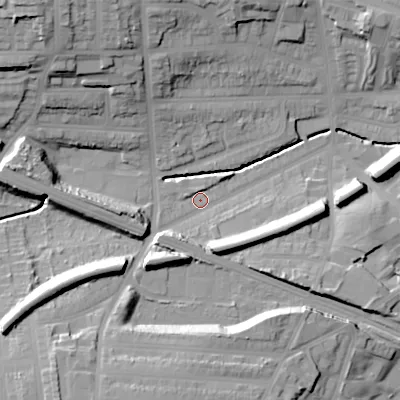 Shaded relief map of the ground around B210TB, computed from Environment Agency LiDAR. The ground here sits at about 124 m above sea level and falls 35 m across the surrounding 800 m. Surface water reaching this point runs off ground lying to the south-south-east, 12.8 m higher.