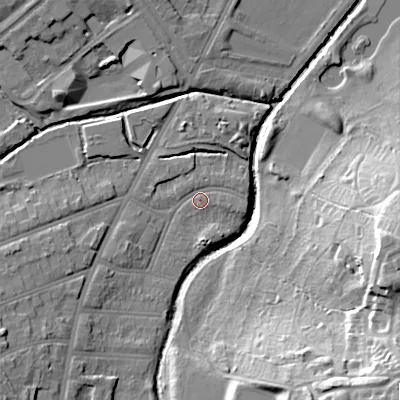 Shaded relief map of the ground around B297ER, computed from Environment Agency LiDAR. The ground here sits at about 115 m above sea level and falls 31 m across the surrounding 800 m. Surface water reaching this point runs off ground lying to the south-west, 8.1 m higher.