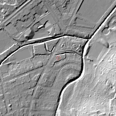 Shaded relief map of the ground around B297ES, computed from Environment Agency LiDAR. The ground here sits at about 115 m above sea level and falls 26 m across the surrounding 800 m. Surface water reaching this point runs off ground lying to the south-west, 1.5 m higher.