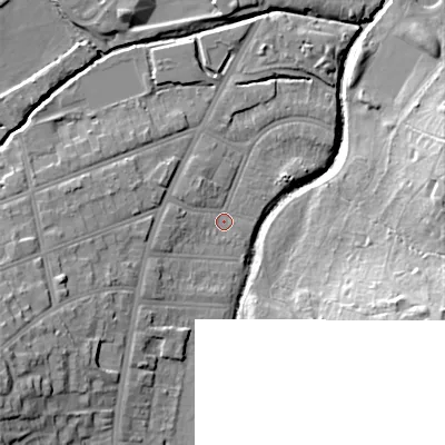 Shaded relief map of the ground around B297EX, computed from Environment Agency LiDAR. The ground here sits at about 115 m above sea level and falls 24 m across the surrounding 800 m. Surface water reaching this point runs off ground lying to the west-south-west, 2.7 m higher.