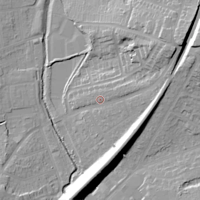 Shaded relief map of the ground around B303AG, computed from Environment Agency LiDAR. The ground here sits at about 134 m above sea level and falls 36 m across the surrounding 800 m. Surface water reaching this point runs off ground lying to the north-east, 23.7 m higher.