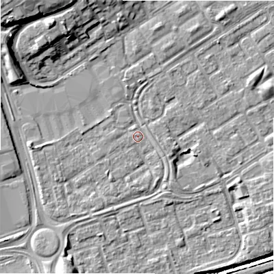 Shaded relief map of the ground around B357QS, computed from Environment Agency LiDAR. The ground here sits at about 82 m above sea level and falls 14 m across the surrounding 800 m. Surface water reaching this point runs off ground lying to the west, 2.6 m higher.