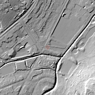 Shaded relief map of the ground around B57RL, computed from Environment Agency LiDAR. The ground here sits at about 115 m above sea level and falls 29 m across the surrounding 800 m. Surface water reaching this point runs off ground lying to the north-west, 7.1 m higher.