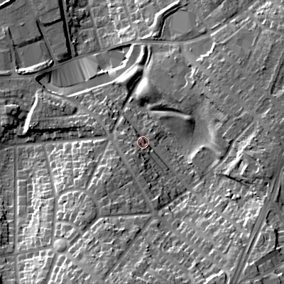 Shaded relief map of the ground around B711QJ, computed from Environment Agency LiDAR. The ground here sits at about 142 m above sea level and falls 25 m across the surrounding 800 m. Surface water reaching this point runs off ground lying to the south, 16.7 m higher.