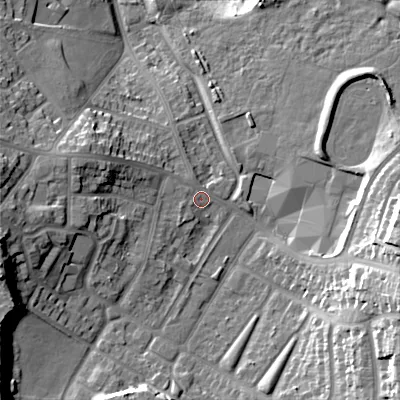 Shaded relief map of the ground around B712BT, computed from Environment Agency LiDAR. The ground here sits at about 124 m above sea level and falls 24 m across the surrounding 800 m. Surface water reaching this point runs off ground lying to the west-north-west, 9.5 m higher.
