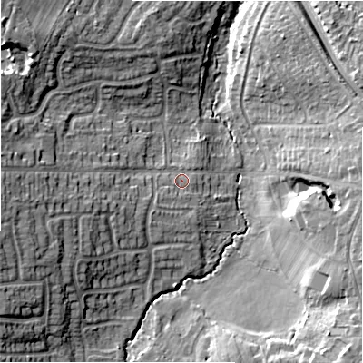 Shaded relief map of the ground around B939HT, computed from Environment Agency LiDAR. The ground here sits at about 118 m above sea level and falls 16 m across the surrounding 800 m. Surface water reaching this point runs off ground lying to the west, 11.6 m higher.