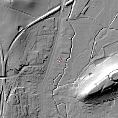 Shaded relief map of the ground around B955AJ, computed from Environment Agency LiDAR. The ground here sits at about 74 m above sea level and falls 35 m across the surrounding 800 m. Surface water reaching this point runs off ground lying to the east, 1.1 m higher.