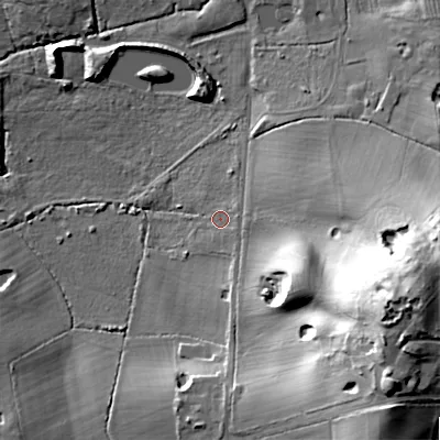 Shaded relief map of the ground around B989AJ, computed from Environment Agency LiDAR. The ground here sits at about 102 m above sea level and falls 52 m across the surrounding 800 m. Surface water reaching this point runs off ground lying to the south-east, 21.5 m higher.