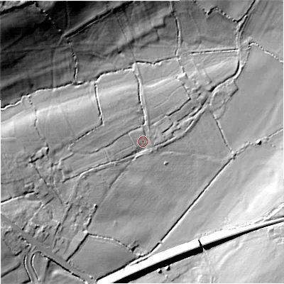 Shaded relief map of the ground around BA112PT, computed from Environment Agency LiDAR. The ground here sits at about 62 m above sea level and falls 38 m across the surrounding 800 m. Surface water reaching this point runs off ground lying to the west, 11.6 m higher.