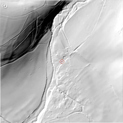 Shaded relief map of the ground around BA127EU, computed from Environment Agency LiDAR. The ground here sits at about 128 m above sea level and falls 70 m across the surrounding 800 m. Surface water reaching this point runs off ground lying to the south-east, 1.5 m higher.
