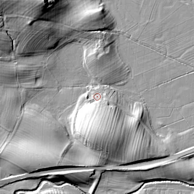 Shaded relief map of the ground around BD233AD, computed from Environment Agency LiDAR. The ground here sits at about 99 m above sea level and falls 25 m across the surrounding 800 m. Surface water reaching this point runs off ground lying to the south, 12.3 m higher.
