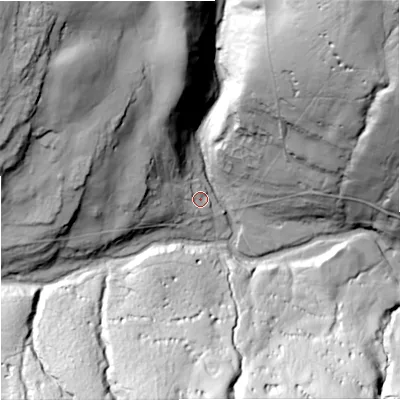 Shaded relief map of the ground around BD235JL, computed from Environment Agency LiDAR. The ground here sits at about 311 m above sea level and falls 90 m across the surrounding 800 m. Surface water reaching this point runs off ground lying to the west-north-west, 14.6 m higher.