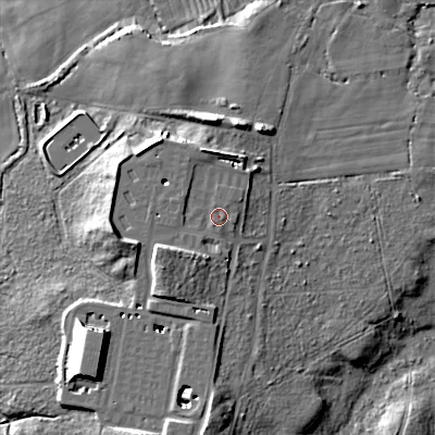 Shaded relief map of the ground around BH205JR, computed from Environment Agency LiDAR. The ground here sits at about 12 m above sea level and falls 18 m across the surrounding 800 m. Surface water reaching this point runs off ground lying to the west, 7.8 m higher.
