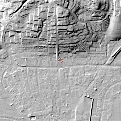Shaded relief map of the ground around BH211DA, computed from Environment Agency LiDAR. The ground here sits at about 19 m above sea level and falls 33 m across the surrounding 800 m. Surface water reaching this point runs off ground lying to the north, 30.4 m higher.