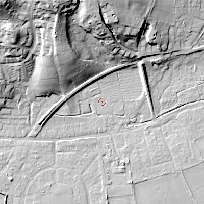 Shaded relief map of the ground around BH212BT, computed from Environment Agency LiDAR. The ground here sits at about 18 m above sea level and falls 35 m across the surrounding 800 m. Surface water reaching this point runs off ground lying to the north-north-west, 35.2 m higher.