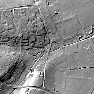 Shaded relief map of the ground around BH213AE, computed from Environment Agency LiDAR. The ground here sits at about 20 m above sea level and falls 14 m across the surrounding 800 m. Surface water reaching this point runs off ground lying to the west-south-west, 11.8 m higher.