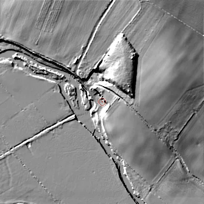 Shaded relief map of the ground around BH214BX, computed from Environment Agency LiDAR. The ground here sits at about 24 m above sea level and falls 23 m across the surrounding 800 m. Surface water reaching this point runs off ground lying to the east-north-east, 8.1 m higher.