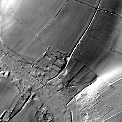 Shaded relief map of the ground around BH215NH, computed from Environment Agency LiDAR. The ground here sits at about 60 m above sea level and falls 26 m across the surrounding 800 m. Surface water reaching this point runs off ground lying to the north, 3.9 m higher.