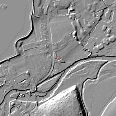 Shaded relief map of the ground around BH229AN, computed from Environment Agency LiDAR. The ground here sits at about 11 m above sea level and falls 12 m across the surrounding 800 m. Surface water reaching this point runs off ground lying to the west, 1.2 m higher.