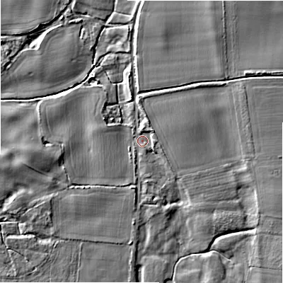 Shaded relief map of the ground around BH243BN, computed from Environment Agency LiDAR. The ground here sits at about 12 m above sea level and falls 6 m across the surrounding 800 m. Surface water reaching this point runs off ground lying to the north, 3.0 m higher.