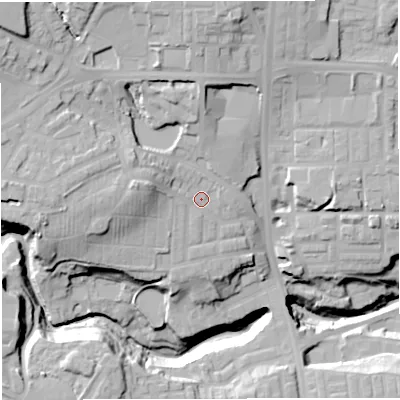 Shaded relief map of the ground around BL16NL, computed from Environment Agency LiDAR. The ground here sits at about 113 m above sea level and falls 42 m across the surrounding 800 m. Surface water reaching this point runs off ground lying to the west, 10.9 m higher.