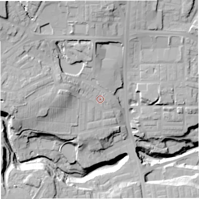 Shaded relief map of the ground around BL16QA, computed from Environment Agency LiDAR. The ground here sits at about 113 m above sea level and falls 42 m across the surrounding 800 m. Surface water reaching this point runs off ground lying to the west, 11.4 m higher.
