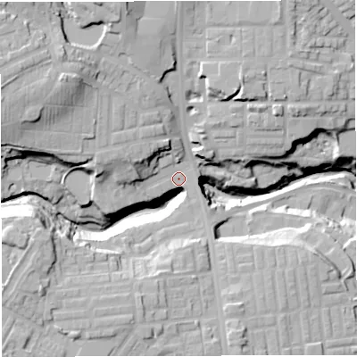 Shaded relief map of the ground around BL18NG, computed from Environment Agency LiDAR. The ground here sits at about 105 m above sea level and falls 36 m across the surrounding 800 m. Surface water reaching this point runs off ground lying to the west-north-west, 32.3 m higher.