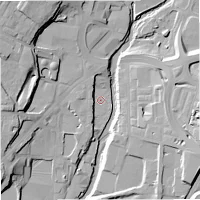 Shaded relief map of the ground around BL82AQ, computed from Environment Agency LiDAR. The ground here sits at about 77 m above sea level and falls 28 m across the surrounding 800 m. Surface water reaching this point runs off ground lying to the north-north-west, 6.8 m higher.
