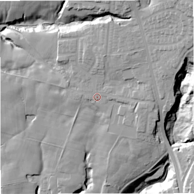 Shaded relief map of the ground around BL95JF, computed from Environment Agency LiDAR. The ground here sits at about 124 m above sea level and falls 40 m across the surrounding 800 m. Surface water reaching this point runs off ground lying to the north-north-east, 9.2 m higher.