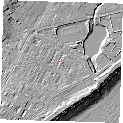 Shaded relief map of the ground around BN227JU, computed from Environment Agency LiDAR. The ground here sits at about 4 m above sea level and falls 11 m across the surrounding 800 m. Surface water reaching this point runs off ground lying to the south, 2.1 m higher.