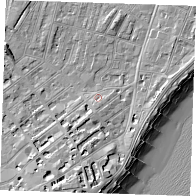 Shaded relief map of the ground around BN228AQ, computed from Environment Agency LiDAR. The ground here sits at about 4 m above sea level and falls 14 m across the surrounding 800 m. Surface water reaching this point runs off ground lying to the south, 2.3 m higher.