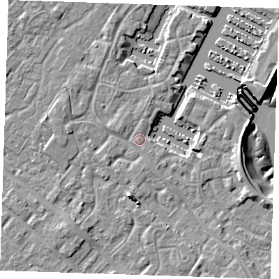 Shaded relief map of the ground around BN235UE, computed from Environment Agency LiDAR. The ground here sits at about 4 m above sea level and falls 10 m across the surrounding 800 m. Surface water reaching this point runs off ground lying to the south, 1.3 m higher.