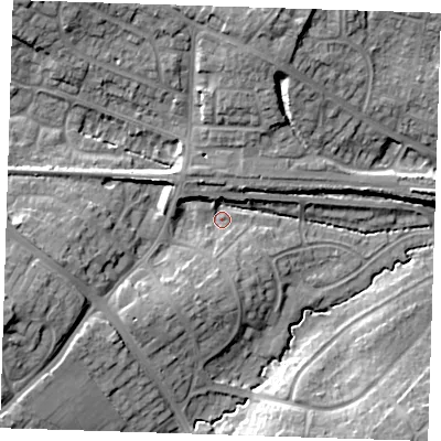 Shaded relief map of the ground around BN265AE, computed from Environment Agency LiDAR. The ground here sits at about 12 m above sea level and falls 16 m across the surrounding 800 m. Surface water reaching this point runs off ground lying to the west, 10.5 m higher.