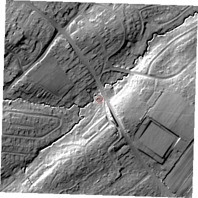 Shaded relief map of the ground around BN265DP, computed from Environment Agency LiDAR. The ground here sits at about 12 m above sea level and falls 17 m across the surrounding 800 m. Surface water reaching this point runs off ground lying to the south-south-west, 9.5 m higher.