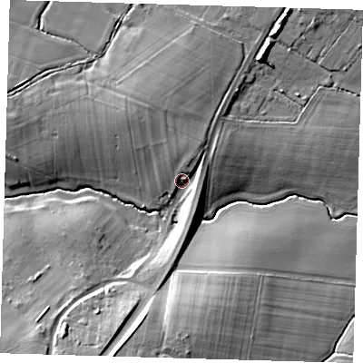 Shaded relief map of the ground around BN85RX, computed from Environment Agency LiDAR. The ground here sits at about 12 m above sea level and falls 16 m across the surrounding 800 m. Surface water reaching this point runs off ground lying to the north, 4.8 m higher.