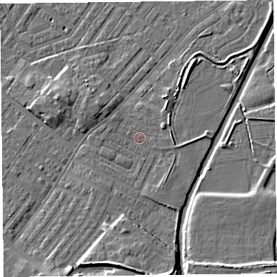 Shaded relief map of the ground around CA12DW, computed from Environment Agency LiDAR. The ground here sits at about 18 m above sea level and falls 11 m across the surrounding 800 m. Surface water reaching this point runs off ground lying to the south, 7.2 m higher.