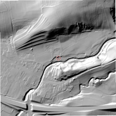 Shaded relief map of the ground around CA174DU, computed from Environment Agency LiDAR. The ground here sits at about 183 m above sea level and falls 69 m across the surrounding 800 m. Surface water reaching this point runs off ground lying to the north-east, 4.8 m higher.