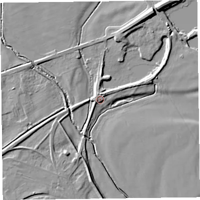 Shaded relief map of the ground around CA65LN, computed from Environment Agency LiDAR. The ground here sits at about 12 m above sea level and falls 11 m across the surrounding 800 m. Surface water reaching this point runs off ground lying to the north, 2.9 m higher.