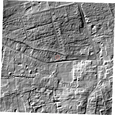 Shaded relief map of the ground around CB223JE, computed from Environment Agency LiDAR. The ground here sits at about 21 m above sea level and falls 9 m across the surrounding 800 m. Surface water reaching this point runs off ground lying to the north, 6.3 m higher.