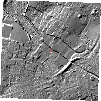 Shaded relief map of the ground around CM235GZ, computed from Environment Agency LiDAR. The ground here sits at about 77 m above sea level and falls 20 m across the surrounding 800 m. Surface water reaching this point runs off ground lying to the north-east, 7.2 m higher.