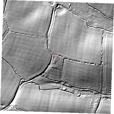 Shaded relief map of the ground around CM50PF, computed from Environment Agency LiDAR. The ground here sits at about 69 m above sea level and falls 15 m across the surrounding 800 m. Surface water reaching this point runs off ground lying to the north-west, 1.6 m higher.