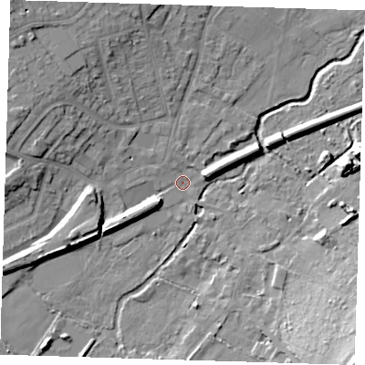 Shaded relief map of the ground around DA51JX, computed from Environment Agency LiDAR. The ground here sits at about 12 m above sea level and falls 23 m across the surrounding 800 m. Surface water reaching this point runs off ground lying to the west-north-west, 9.2 m higher.