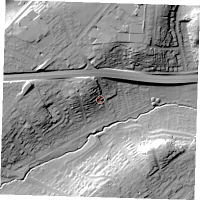 Shaded relief map of the ground around DA51RQ, computed from Environment Agency LiDAR. The ground here sits at about 23 m above sea level and falls 33 m across the surrounding 800 m. Surface water reaching this point runs off ground lying to the north-west, 15.3 m higher.