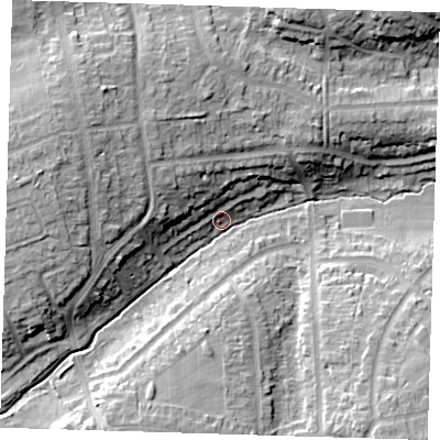 Shaded relief map of the ground around DA53ES, computed from Environment Agency LiDAR. The ground here sits at about 22 m above sea level and falls 15 m across the surrounding 800 m. Surface water reaching this point runs off ground lying to the west-north-west, 14.0 m higher.