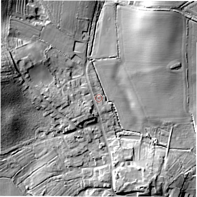 Shaded relief map of the ground around DE128DB, computed from Environment Agency LiDAR. The ground here sits at about 75 m above sea level and falls 21 m across the surrounding 800 m. Surface water reaching this point runs off ground lying to the west, 7.2 m higher.