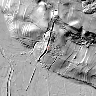 Shaded relief map of the ground around DL116AS, computed from Environment Agency LiDAR. The ground here sits at about 209 m above sea level and falls 136 m across the surrounding 800 m. Surface water reaching this point runs off ground lying to the north, 25.0 m higher.